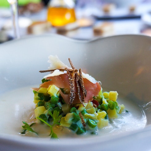 A gastronomic dish at a Michelin restaurant topped with shaved truffles