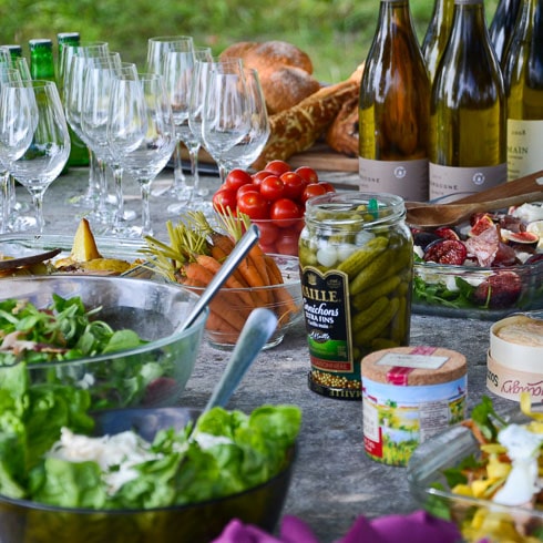 A DuVine-style picnic lunch of salad, cornichons, Chardonnay, and tomatoes