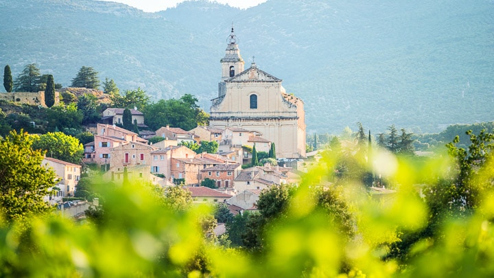 Landscape of church with ornamental bellow tower in the village of Bedoin, Provence, France